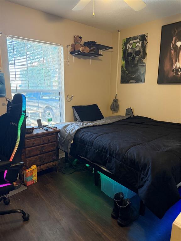 2861 Surf Drive Deltona, FL 32738 - Photo 9 of 20 a bedroom with a bed and a window