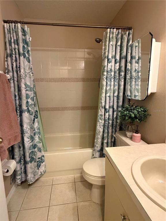 2861 Surf Drive Deltona, FL 32738 - Photo 10 of 20 a bathroom with a sink toilet and shower