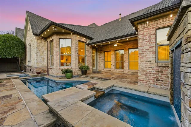 a view of swimming pool with outdoor seating