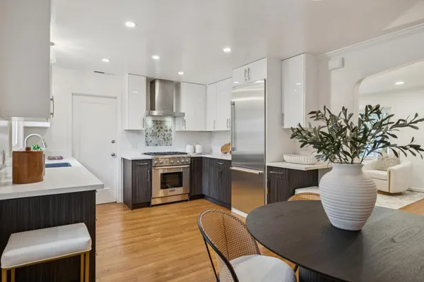 a kitchen with a table and chairs