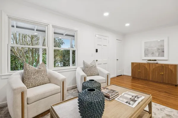 a living room with furniture and a window