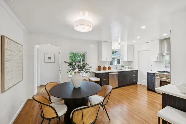 a kitchen with a table and chairs in it