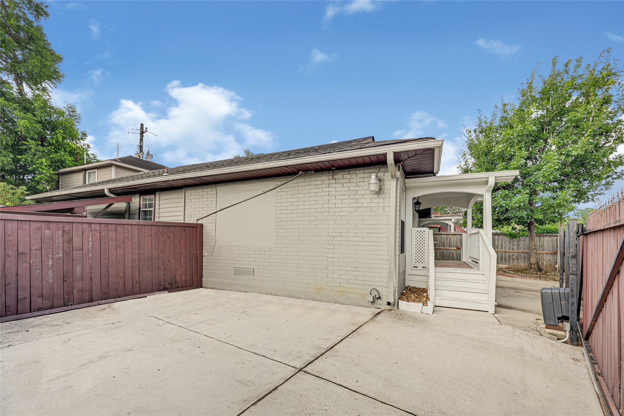 2809 Tooke Street Houston, TX 77023 - Photo 12 of 50 a view of a patio with table and chairs with wooden fence