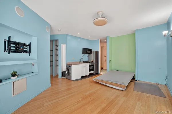 a view of kitchen center island and wooden floor