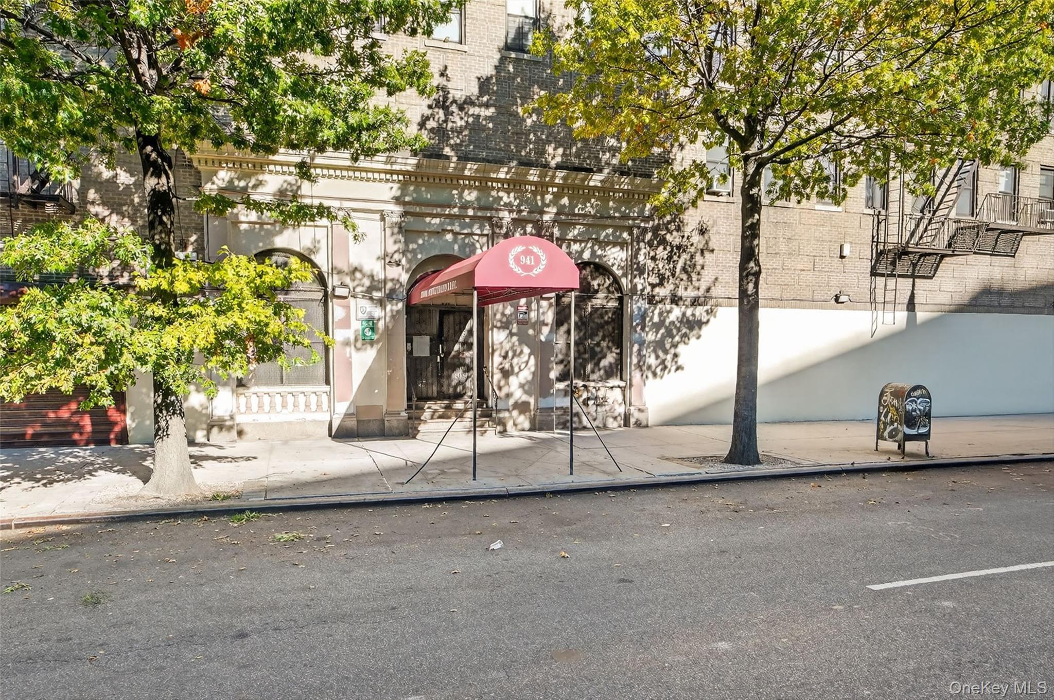 941 Jerome Avenue, Unit 8F Bronx, NY 10452 - Photo 2 of 17 a view of a street with a tree