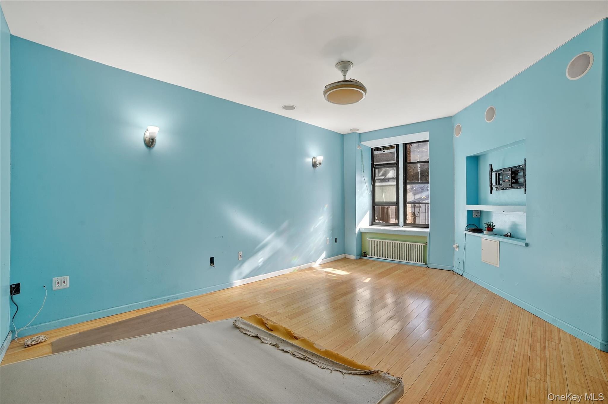 941 Jerome Avenue, Unit 8F Bronx, NY 10452 - Photo 8 of 17 a bed room with a bed and closet