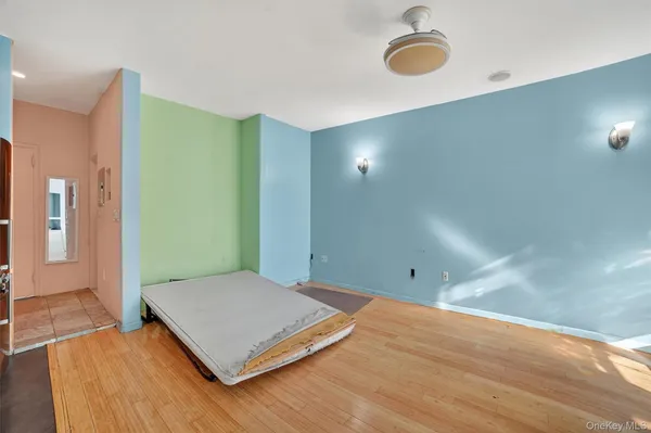 a view of a room with wooden floor