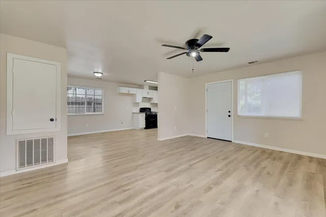 a view of an empty room with a window