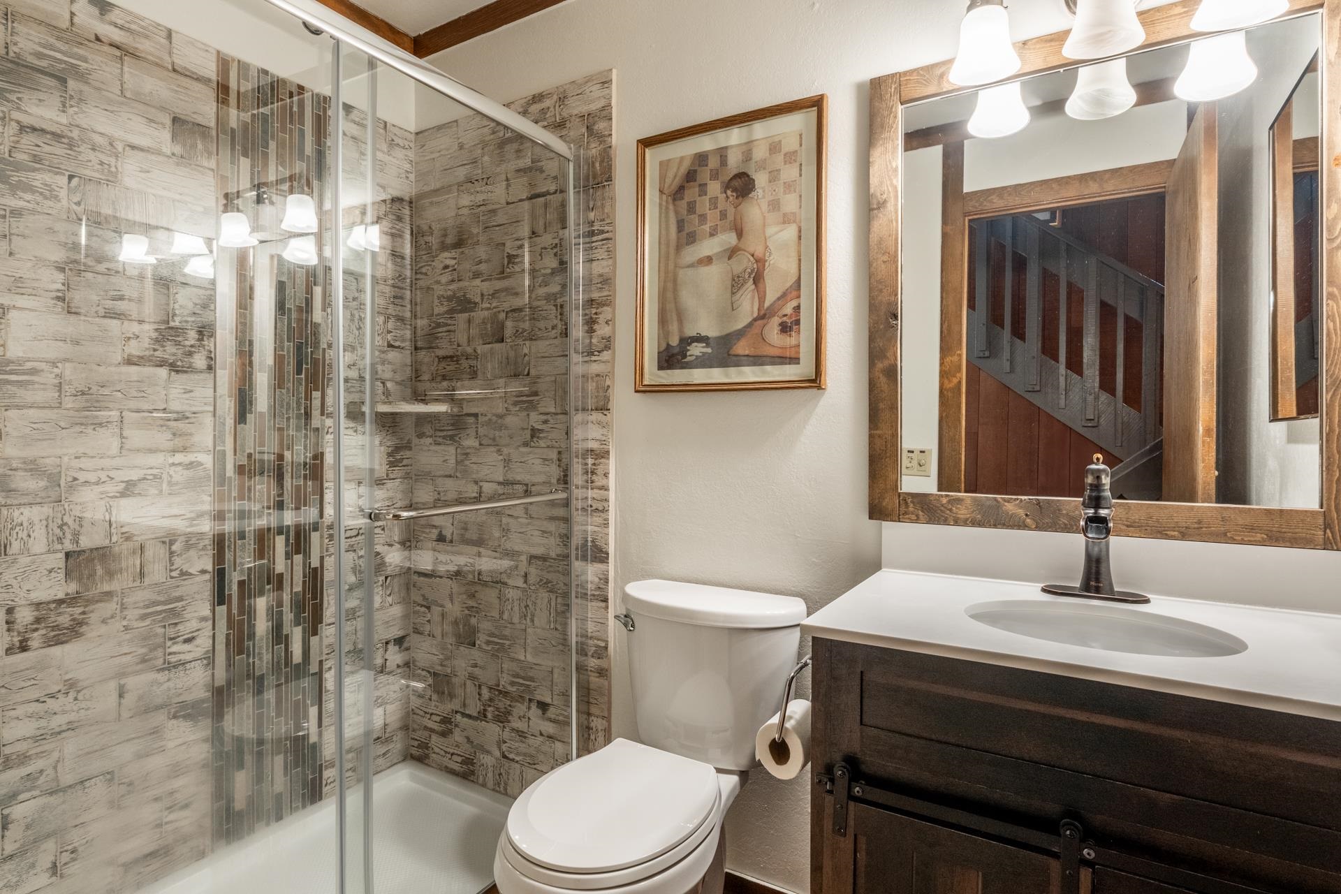 94 John Muir Road, Unit 127 Mammoth Lakes, CA 93546 - Photo 19 of 32 a bathroom with a sink a toilet and shower