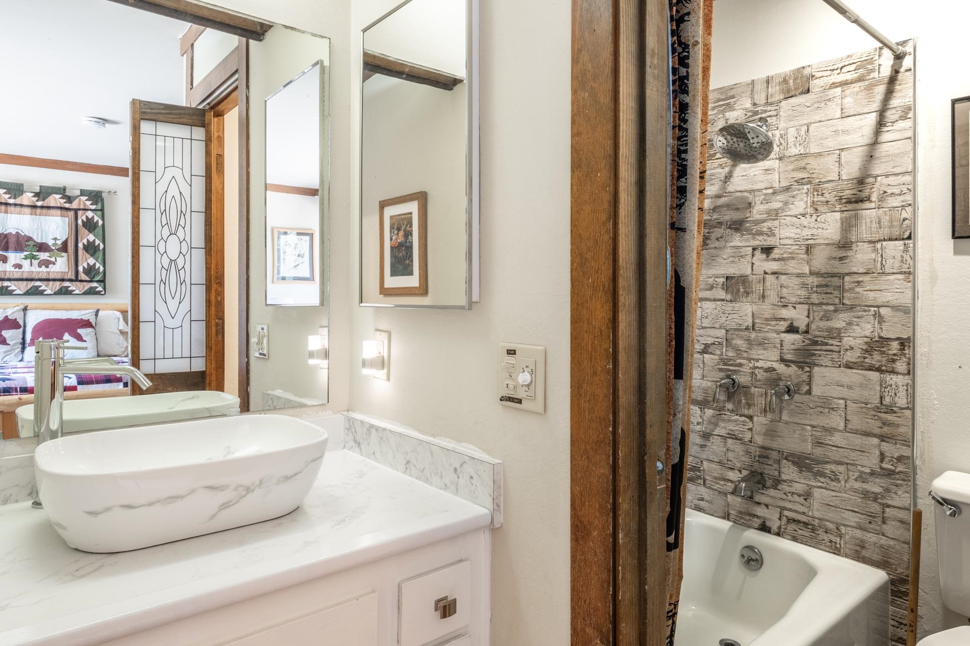 94 John Muir Road, Unit 127 Mammoth Lakes, CA 93546 - Photo 26 of 32 a bathroom with a sink and a bathtub