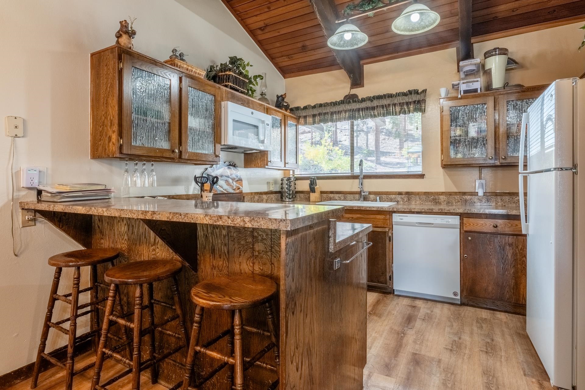 94 John Muir Road, Unit 127 Mammoth Lakes, CA 93546 - Photo 10 of 32 a kitchen with a sink stove and cabinets