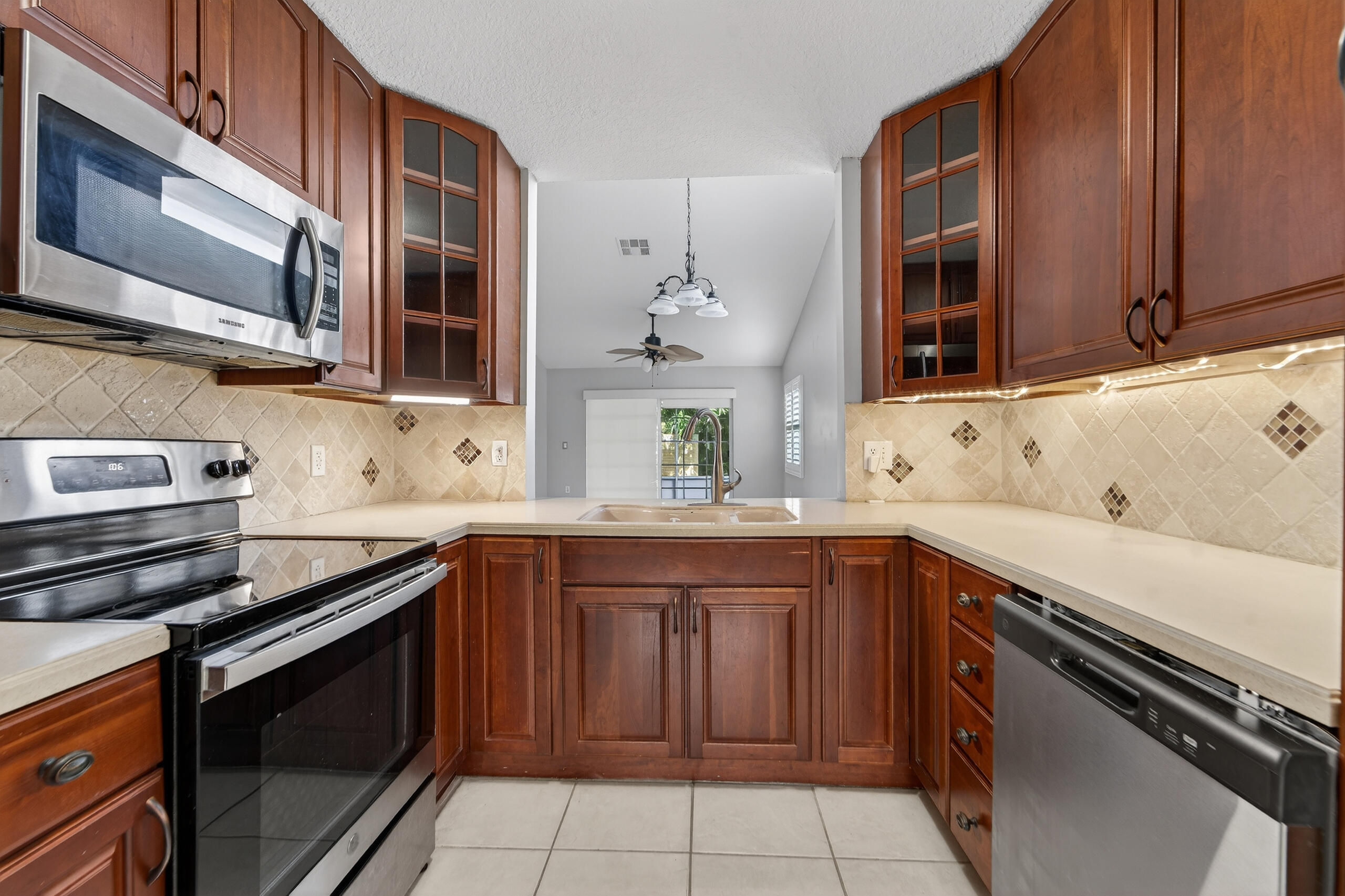 13164 Quiet Woods Road, Unit B Wellington, FL 33414 - Photo 5 of 48 Tons of storage in the Kitchen!