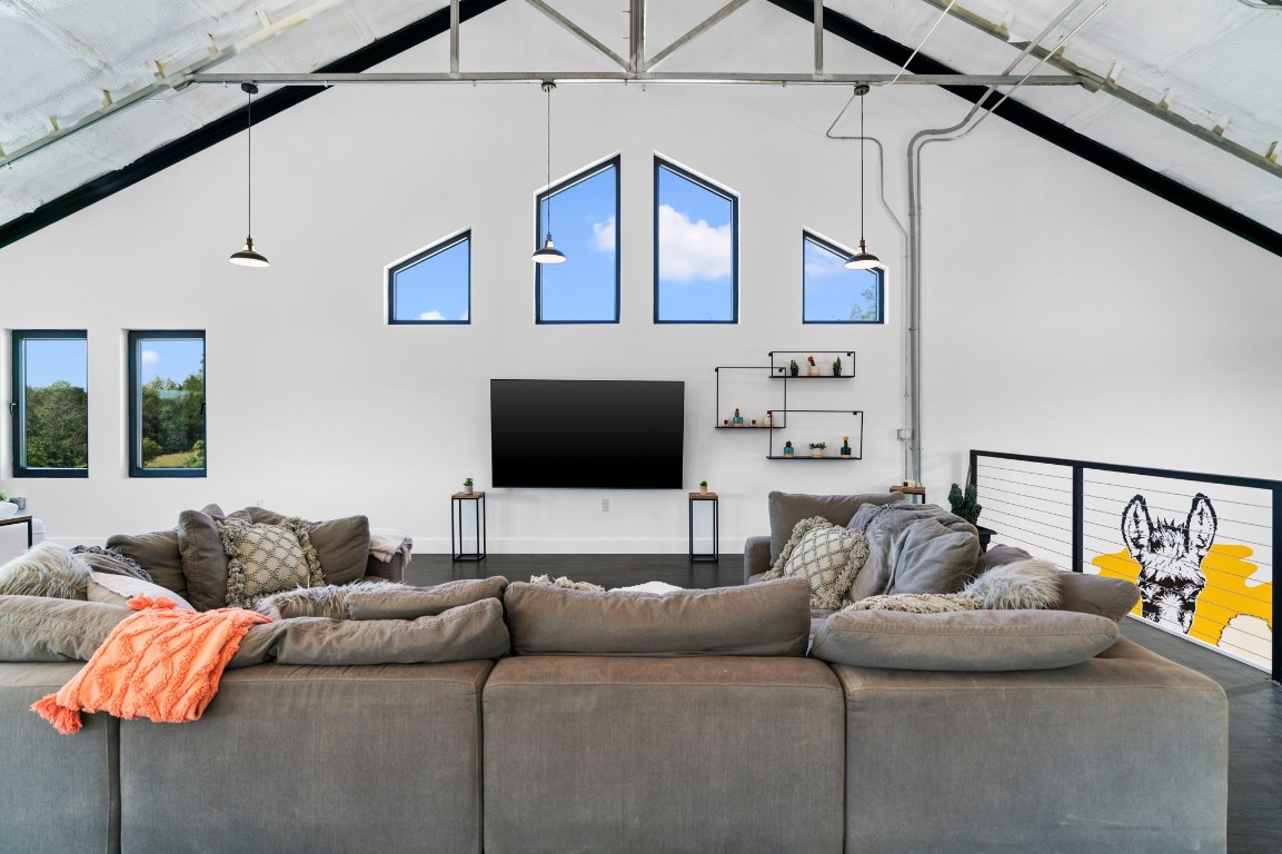 12701 Trails End Road Leander, TX 78641 - Photo 12 of 18 Upper-level lounge area overlooking the indoor recreation court, featuring seating area and open railing.