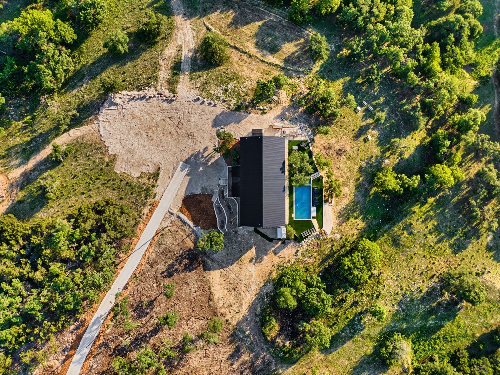 12701 Trails End Road Leander, TX 78641 - Photo 18 of 18 Top-down aerial view showing the main residence, pool area, drive approach and surrounding Hill Country terrain.