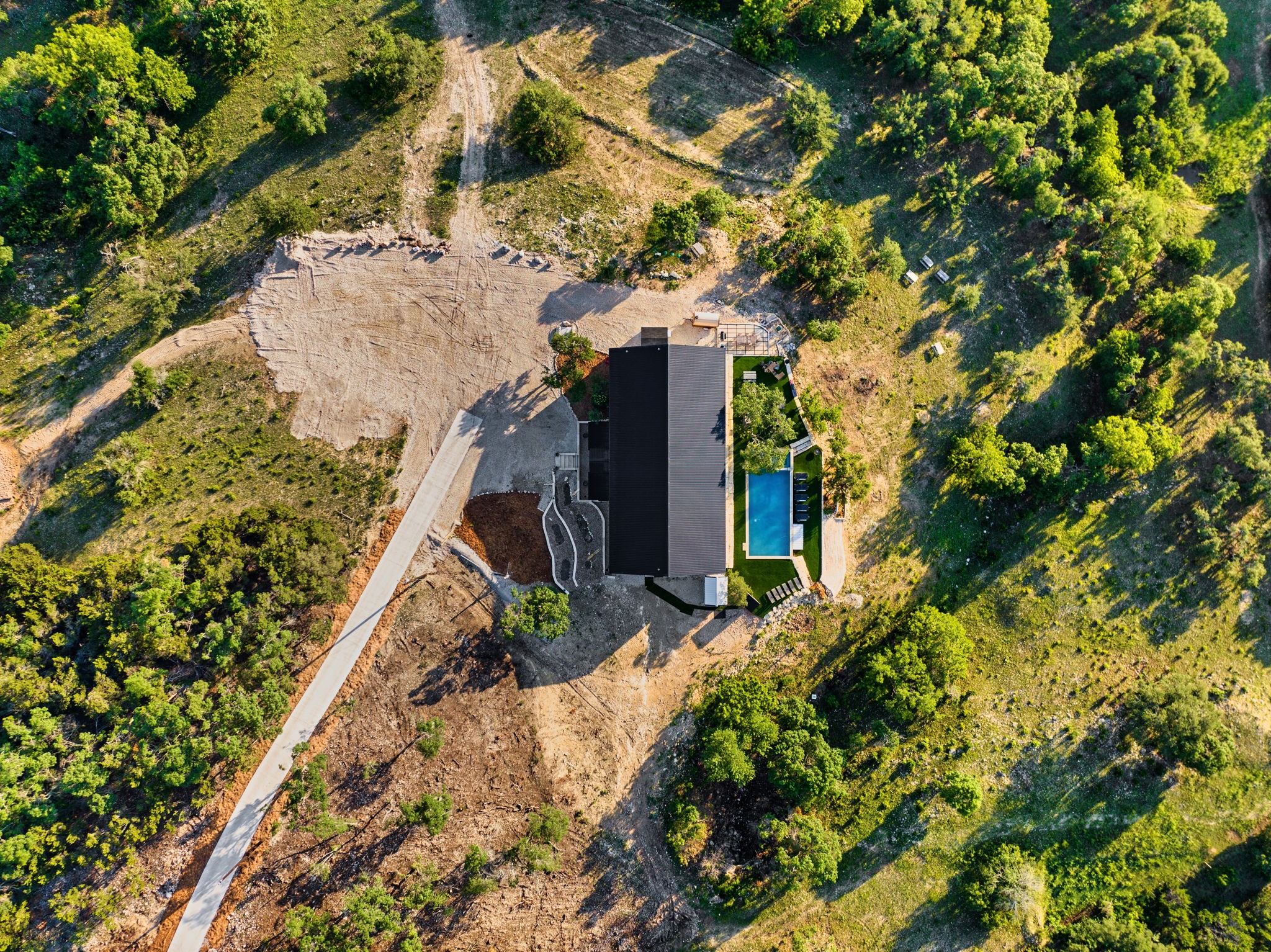 12701 Trails End Road Cedar Park, TX 78613 - Photo 18 of 18 Top-down aerial view showing the main residence, pool area, drive approach and surrounding Hill Country terrain.