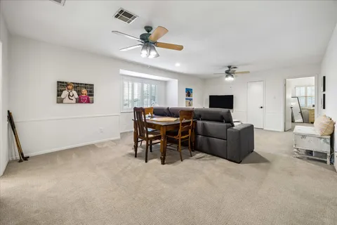 a bedroom with a bed chair and window