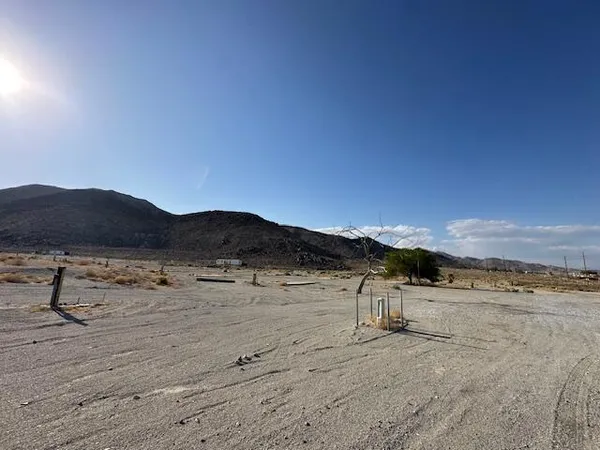 a view of a room with gym equipment and view of living room