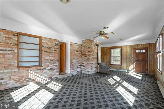 a view of empty room with windows