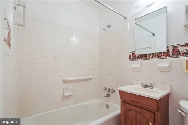 a bathroom with a sink a toilet and vanity