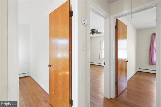 a view of a bathroom from a hallway