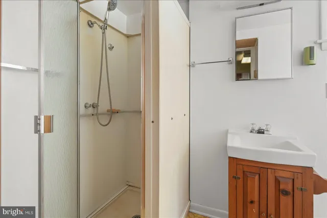 a bathroom with a sink and mirror