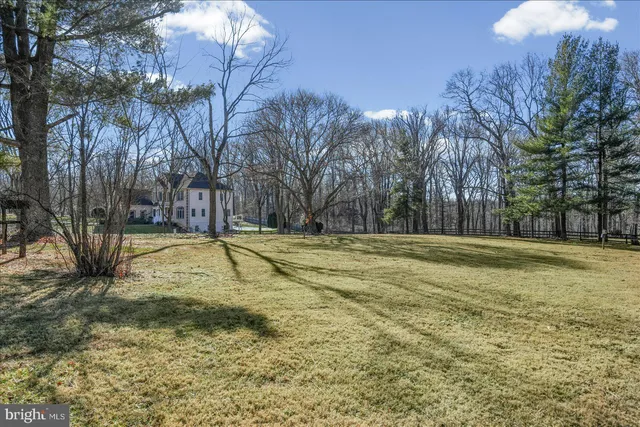 a view of a backyard with sitting area