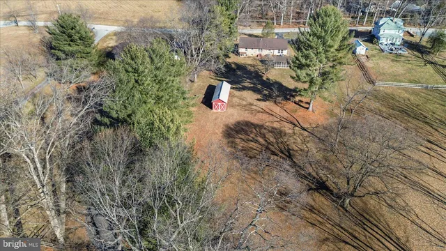 a view of a lake with a dry yard