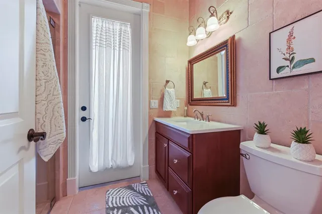 a bedroom with bed couch and window