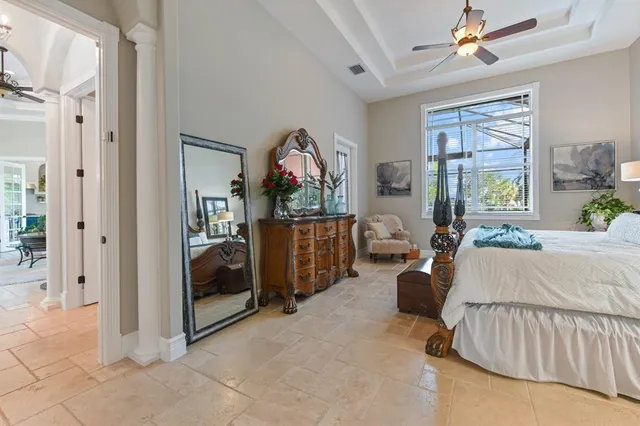 a bedroom with furniture and a window