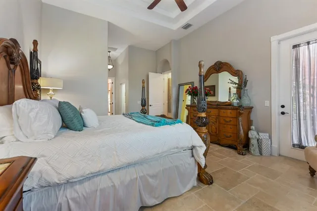 a spacious bathroom with a tub sink and mirror