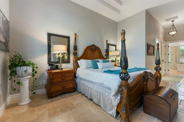 a bathroom with a tub a double vanity sink a mirror and shower