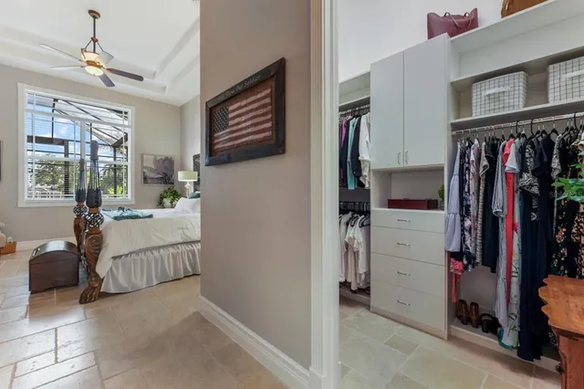 a spacious bathroom with a tub sink and mirror