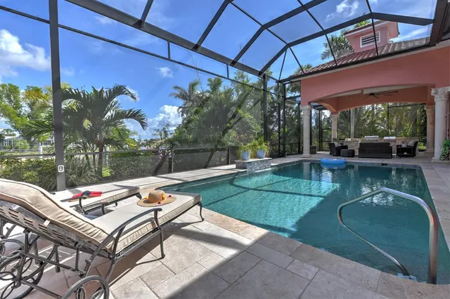 a view of a swimming pool with a patio