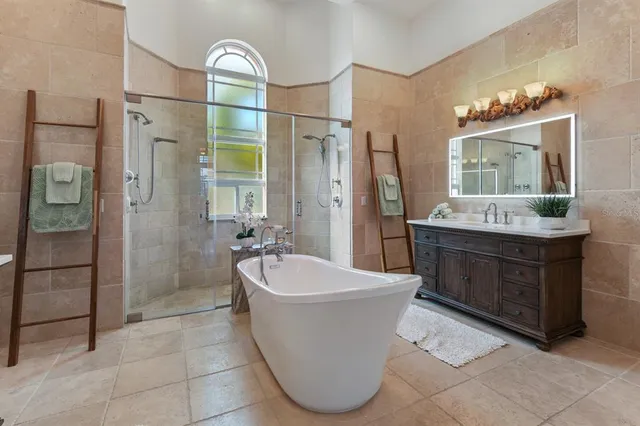 a bedroom with a bed and a couch with window