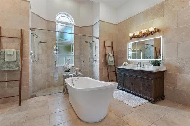 a bedroom with a bed and a lamp