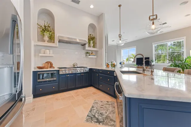 a lobby with furniture and a chandelier