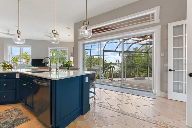 a living room with fireplace furniture and a potted plant