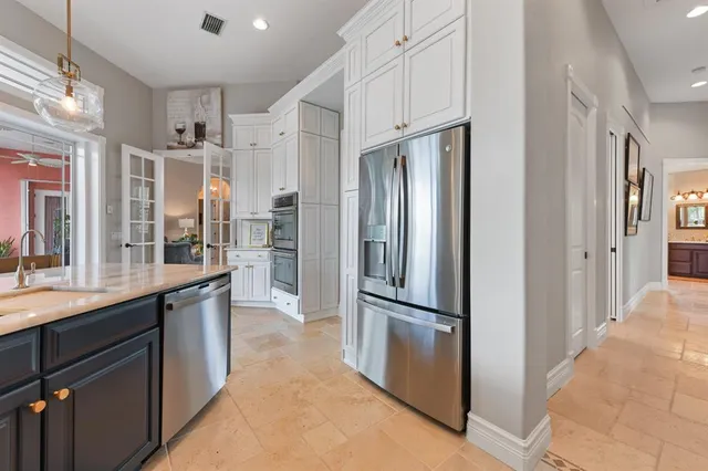 a living room with furniture a flat screen tv and a window