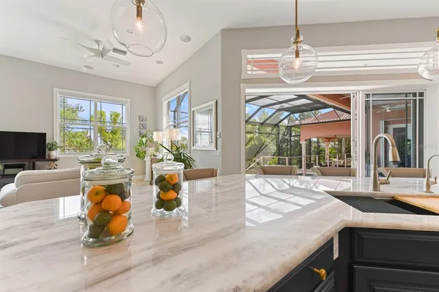 a living room with furniture and painting on the wall