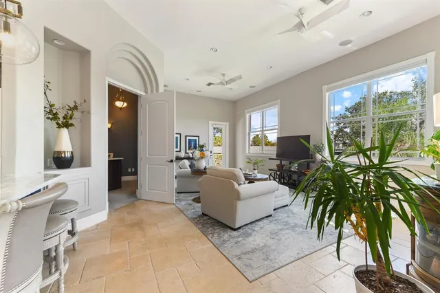 a view of a patio with couches chairs and a potted plant