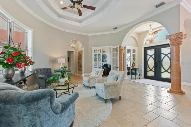 a view of a workspace with furniture and a bookshelf