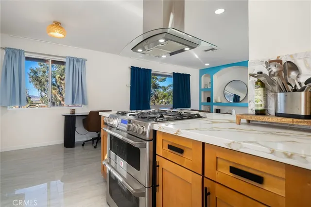 a kitchen with a stove and a sink