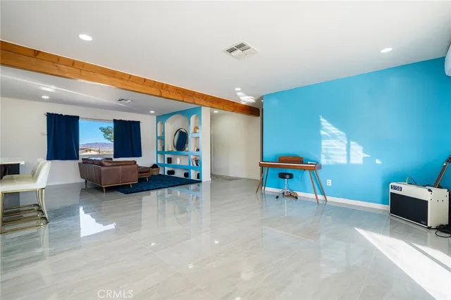 a living room with furniture and a table