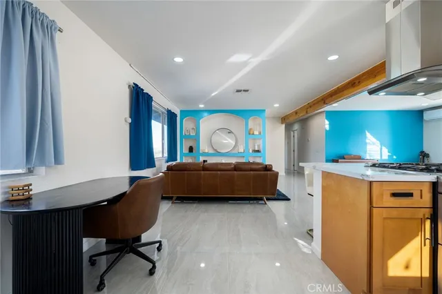 a spacious bedroom with a bed and a table in it