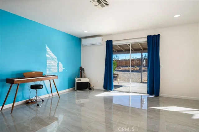 a bedroom with furniture and a window