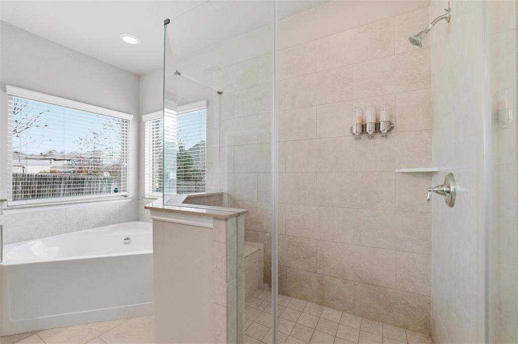 420 Prairie Run Aledo, TX 76008 - Photo 22 of 38 a bathroom with a granite countertop sink a toilet and shower
