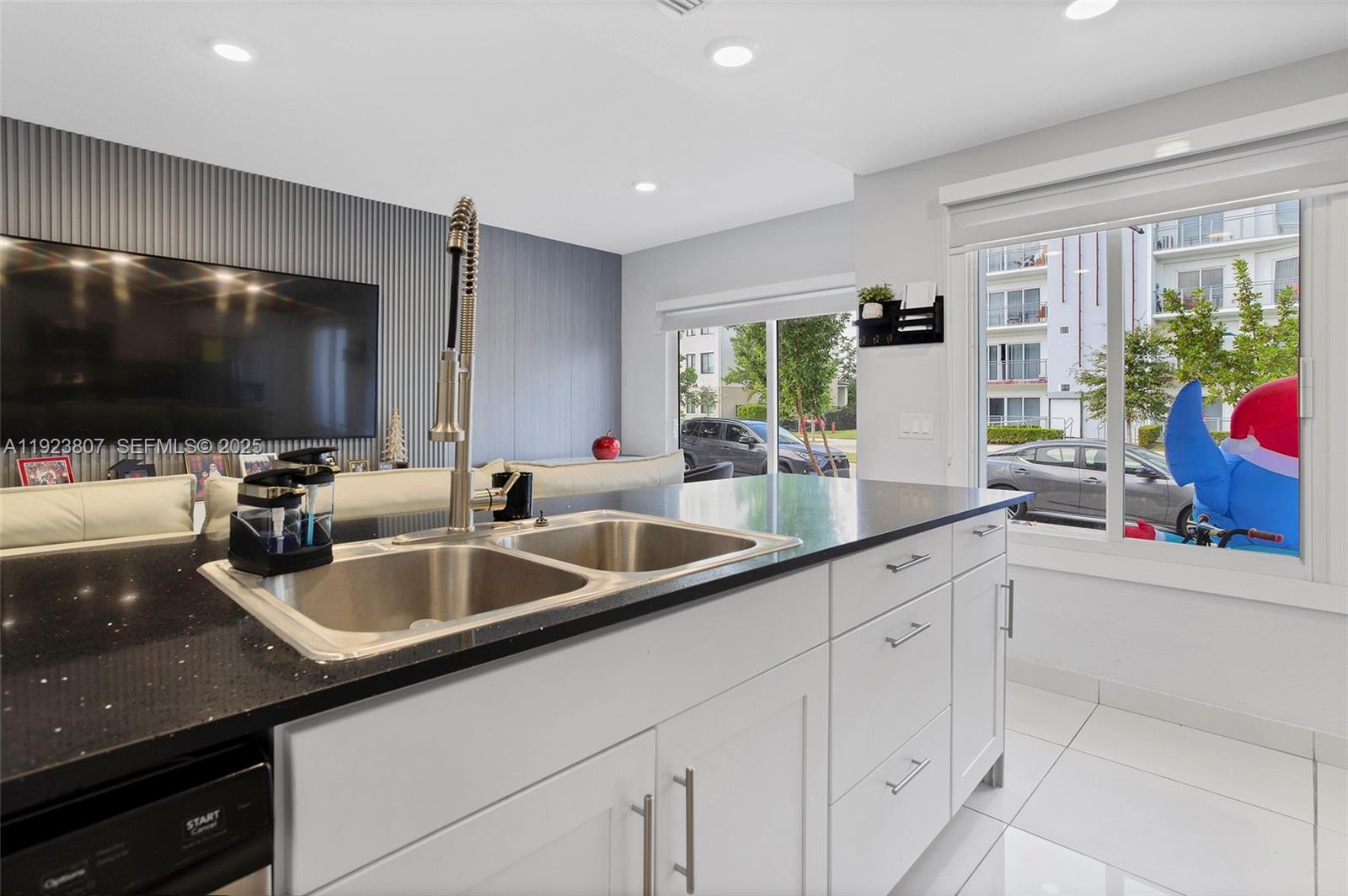 25872 Southwest 139th Path Homestead, FL 33032 - Photo 12 of 51 a kitchen with granite countertop a sink and appliances