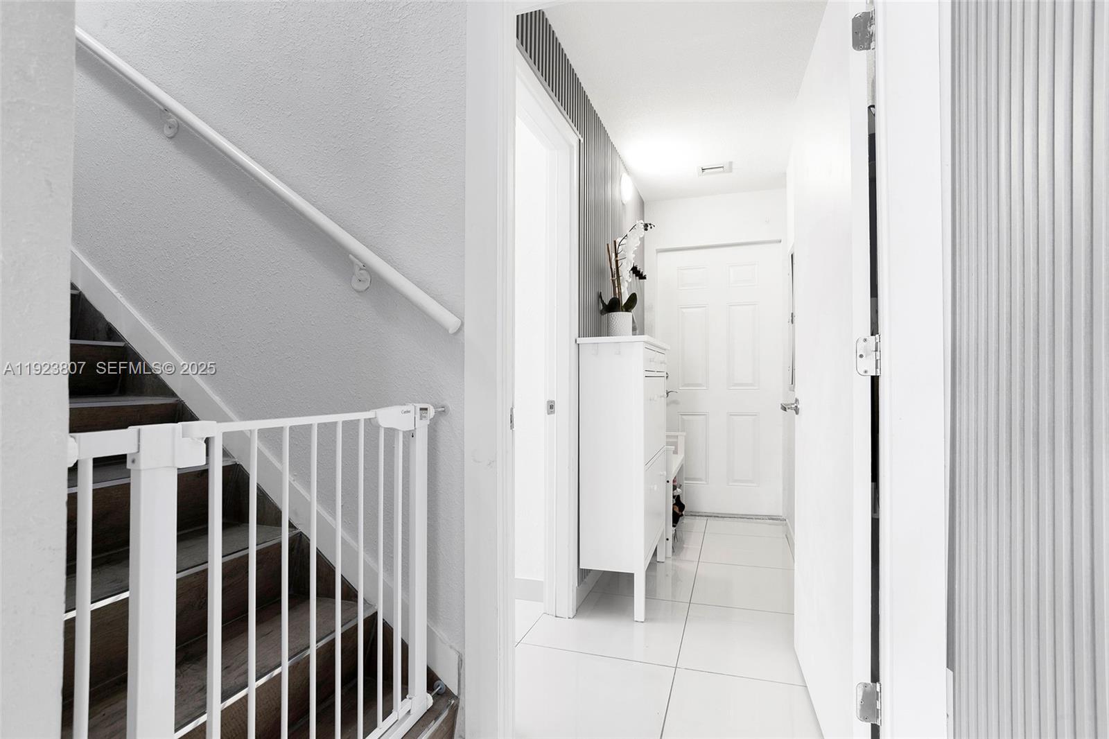 25872 Southwest 139th Path Homestead, FL 33032 - Photo 15 of 51 a view of a hallway with wooden floor and staircase