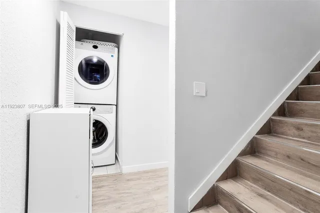 a view of a storage and utility room with washer and dryer