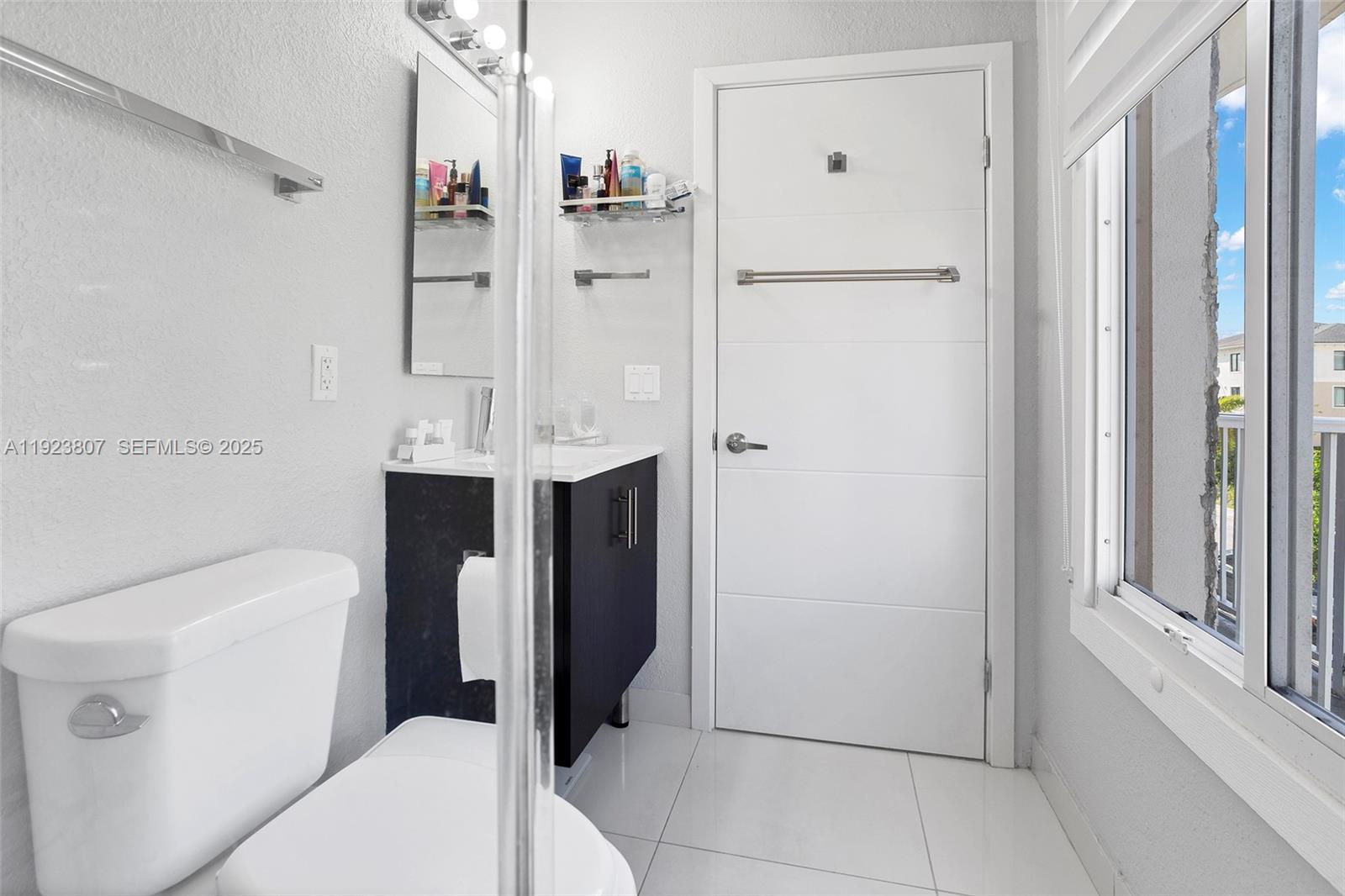 25872 Southwest 139th Path Homestead, FL 33032 - Photo 17 of 51 a bathroom with a toilet sink and shower